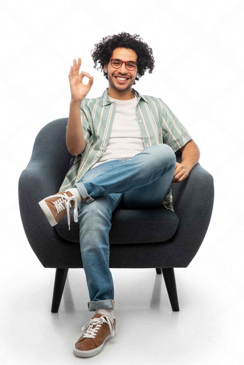 UAE resident smiling on a rented sofa in a Dubai apartment